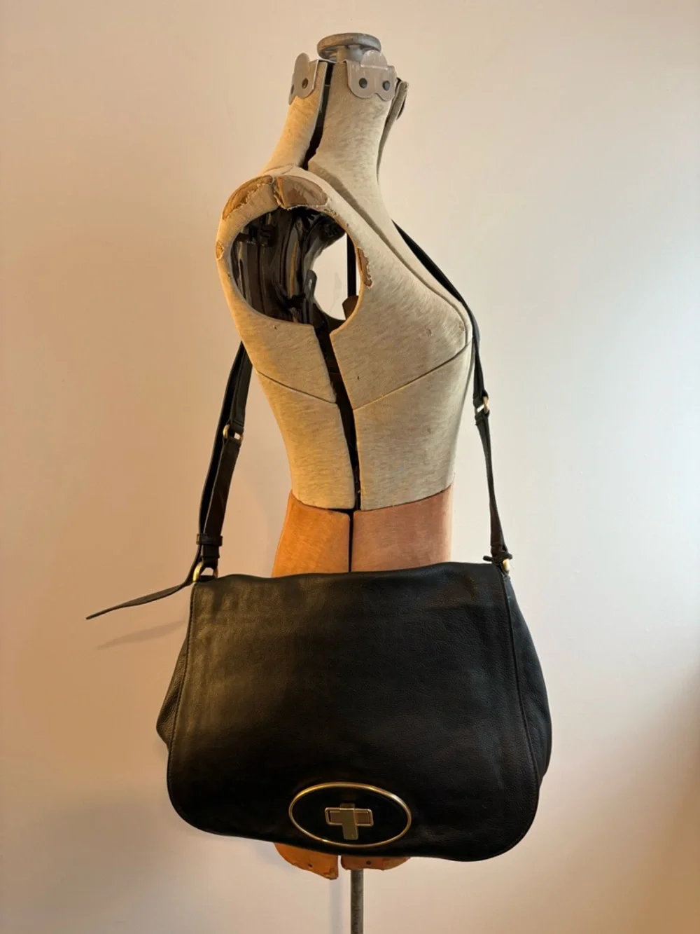 Cole Haan black leather messenger bag with gold hardware